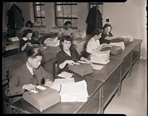 Checking Prints: IRS Workers Checking Tax Forms