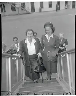 Prints of (Original Caption). New York: Golda Meir Off To Israel. International Airport at Idlewild. Golda Meir, Ambassador from Israel departing from New York city Timeless Moments: Israeli Ambassador Golda Meir Entering Airplane Alongside Stewardess