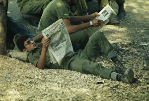 Huty31503 Prints: Israeli Soldier Reading Newspaper