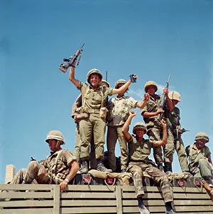 Israeli Troops Raising Weapons Overhead