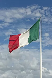 Italian flag against cloudy sky