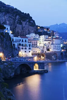 Images Dated 16th October 2015: Italy, Campania, Atrani, Town on coastline at dusk