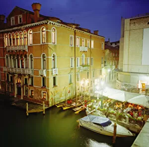 Italy, Venice, restaurants on Grand Canal at night, elevated view
