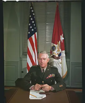 J. Lawton Collins Seated at Desk