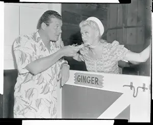 Jack Carson Feeding Straw to Ginger Rogers