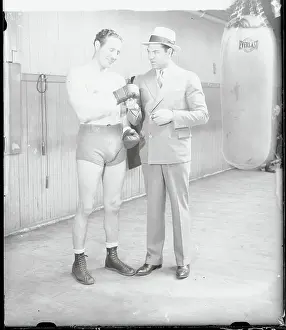 Jack Dempsey Examining Max Baer's Gloves