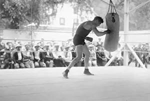 Jack Dempsey Hitting Punching Bag