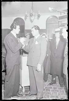 Prints of (Original Caption). Jack Dempsey, former heavyweight champion, greets Jack Doyle, Irish heavyweight champion, who arrived in New York, February 7th The Fighting Spirit: Jack Dempsey Through the Len: Jack Dempsey Holding Hand of Visiting Boxer Jack Doyle