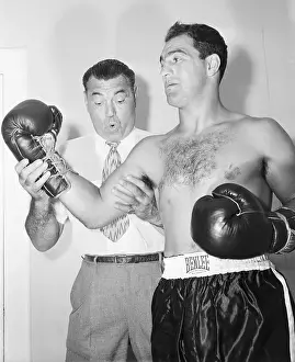 Jack Dempsey Looking Rocky Marciano's Arm