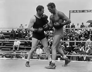 Jack Dempsey and Max Baer Squaring Off