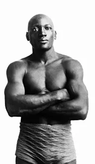 Prints of NEW YORK, NY - CIRCA 1901: Heavyweight professional boxer Jack Johnson (1878-1946) of the United States poses for a portrait circa 1901 in New York, New York In the Ring: The Art of Boxing: Jack Johnson