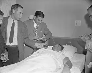 Hospital Bed Prints: Jack Leonard Holding Press Conference from Hospital