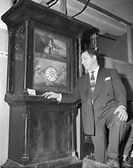 Jack Lubin Inspecting a Clock