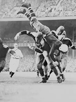 Football Uniform Prints: Jack McBride Upended During Football Game