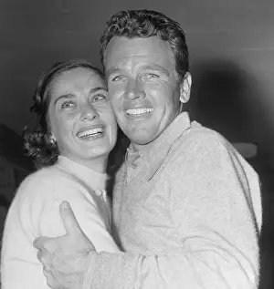 Jackie Burke Hugging His Wife