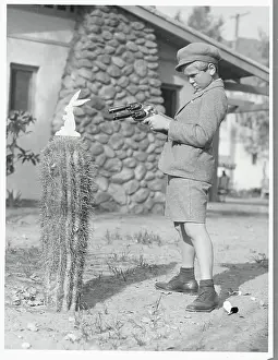Jackie Cooper Aiming a Gun