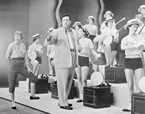 Jackie Gleason with Dancers Holding Banjos