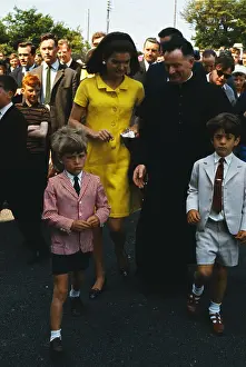 Jackie Kennedy with John F Kennedy Jr and Priest