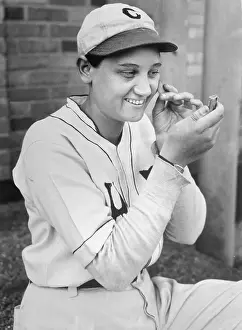 Jackie Mitchell Checking Her Face in Compact Mirror