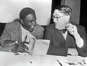 Jackie Robinson and Branch Rickey Looking at Book