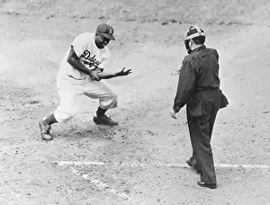 Jackie Robinson Crouching Down Holding Arm