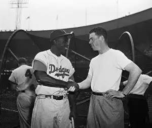 Jackie Robinson and Gil McDougald Shaking Hands