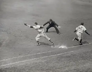 Jackie Robinson Making Successful Run to First Base