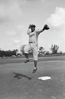 Jackie Robinson Making Toss in Midair