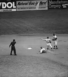 Jackie Robinson and Pee Wee Reese During Game