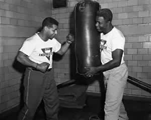 Jackie Robinson and Roy Campanella Working with Boxing Bag