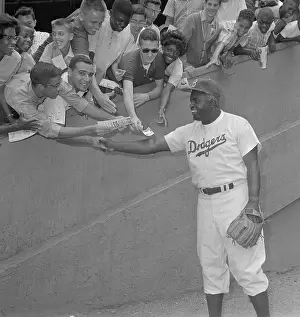 Jackie Robinson Shaking Hands with Fans