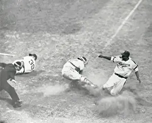 Jackie Robinson Sliding Safely Into Home Plate