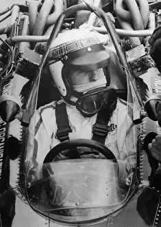 Jackie Stewart Sitting in Race Car