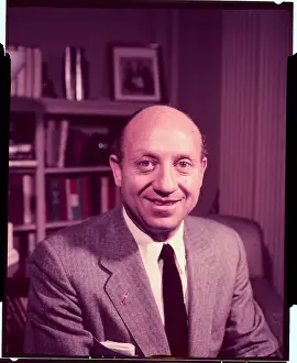 Jacob K Prints: Jacob K. Javits Sitting in Front of Bookshelf