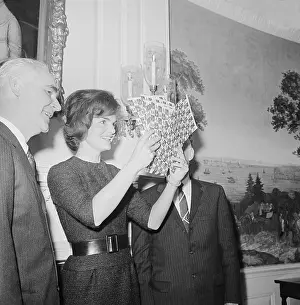 Jacqueline Kennedy Looking at Christmas Seals