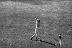 Jacqueline Kennedy Swinging a Golf Club