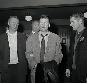 Jacques Angelvin Being Escorted by Police Detective