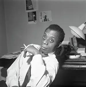 James Baldwin Sitting Smoking A Cigarette