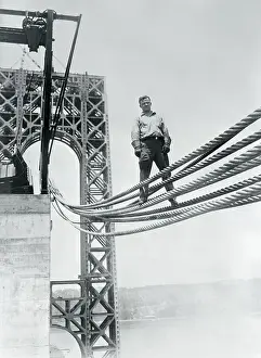 James Bowers Standing on Bridge Cables