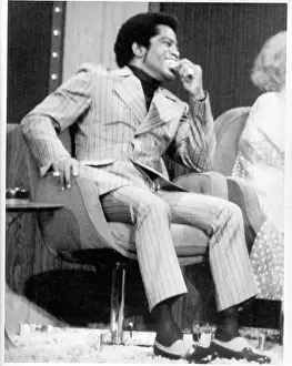 Prints of CIRCA 1975: Godfather of Soul James Brown visits a talk show in circa 1975. (Photo by Michael Ochs Archives/Getty Images) Soul Power: A Visual Journey Through the Godfather of Soul’s Electrifying Legacy: James Brown On A Talk Show