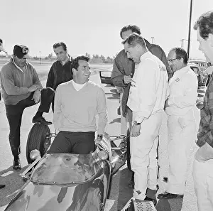 James Garner Slipping into a Race Car