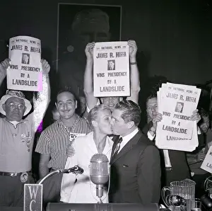 James Hoffa Kisses Wife Beneath Poster