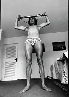 Prints of James Hunt (1947 - 1993), British racing driver, 29 years old, at home working out, UK, 16th September 1977. (Photo by Ben Martin/Getty Images) Legends of the Track: James Hunt
