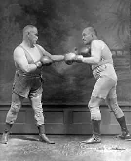 Prints of NEW YORK, NY - 1928: Former Heaveyweight Champion James J. Jeffries (right) and Tom Sharkey appearing on the Vaudeville Circuits, New York, New York, 1928 In the Ring: The Art of Boxing: James J. Jeffries and Tom Sharkey