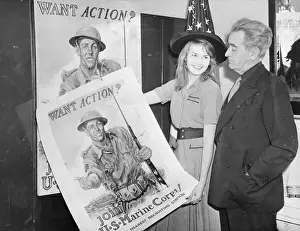 James Montgomery Flagg and Daughter Displaying Marine Posters