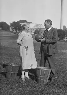 Prints of (Original Caption). Originators of Basketball Discuss the Game. Lawrence, Kansas: Photo shows Mr. and Mrs. James Naismith, discussing the game of basketball of which they are the originators Hoops Through Time: A Visual Journey of Basketball History: James Naismith Speaking to His Wife