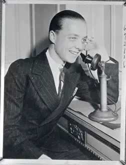 James Paul Donahue Talking on Telephone