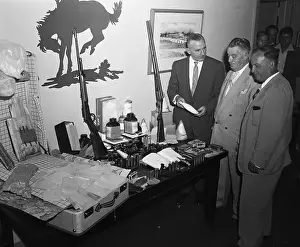 William A Prints: James Ryan Looking Over Confiscated Narcotics