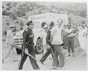 Albuquerque Prints: James Upton Being Escorted to a Police Car