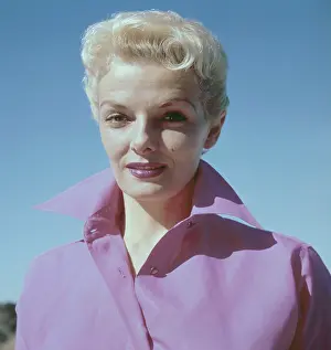 Prints of Headshot of actress Jane Russell pictured wearing a wide-collared pink shirt, USA, circa 1960. A blonde Russell is also wearing lipstick which matches the colour of her shirt Hollywood's Sultry Siren – A Photographic Tribute: Jane Russell